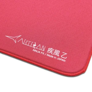 An image showcasing the corner of a wine red Artisan FX Hayate Otsu mouse pad