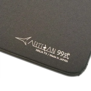 An image showcasing the corner of a gray Artisan FX Raiden mouse pad