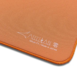 An image showcasing the corner of a daidai orange Artisan FX Zero mouse pad
